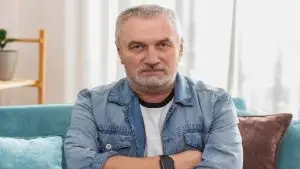 Photo of an angry, seething older man.