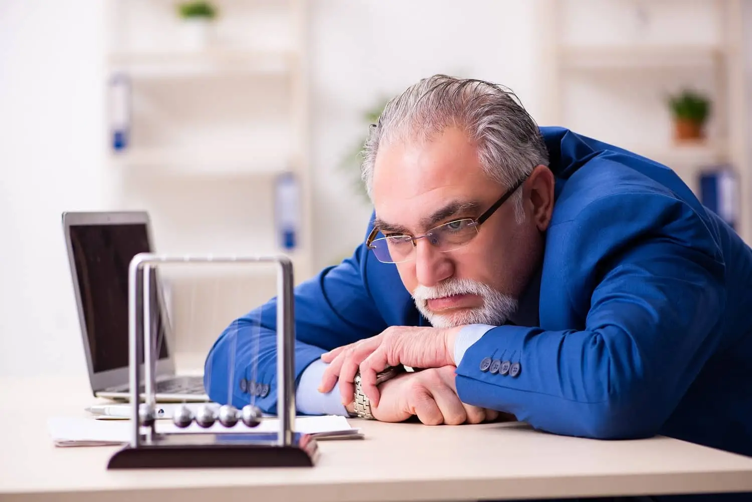 Photo of a bored, retired businessman.
