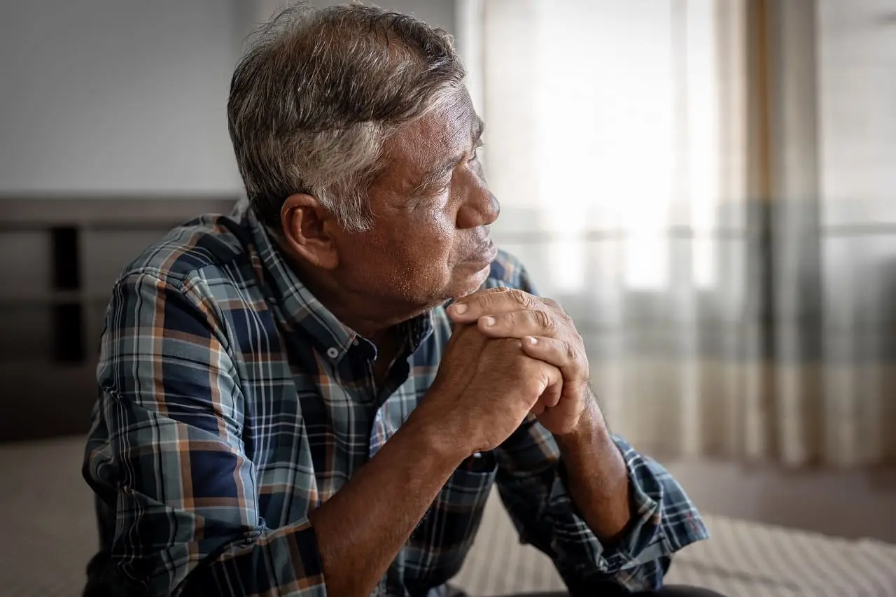 Photo of an isolated, lonely, burned-out older man.