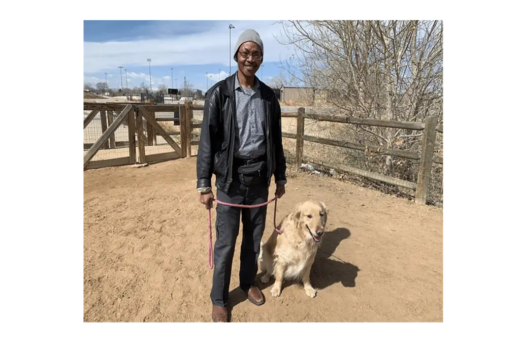 Photo of Kenny Cobbins with his dog, Cooper - Photo originally from Westword.