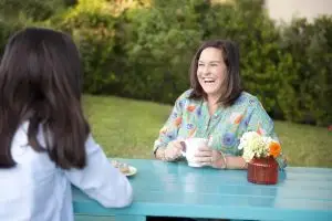 Photo of Kristin Schell with her Turquoise Table.