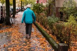 Older woman walking outdoors.