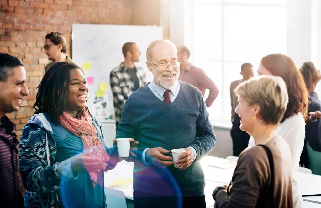 Photo of people in conversation.