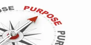 Photo of a compass needle pointing to purpose.