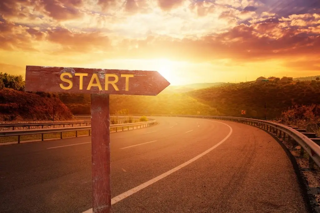 Photo of a start sign at sunrise reflecting the start of a new day.