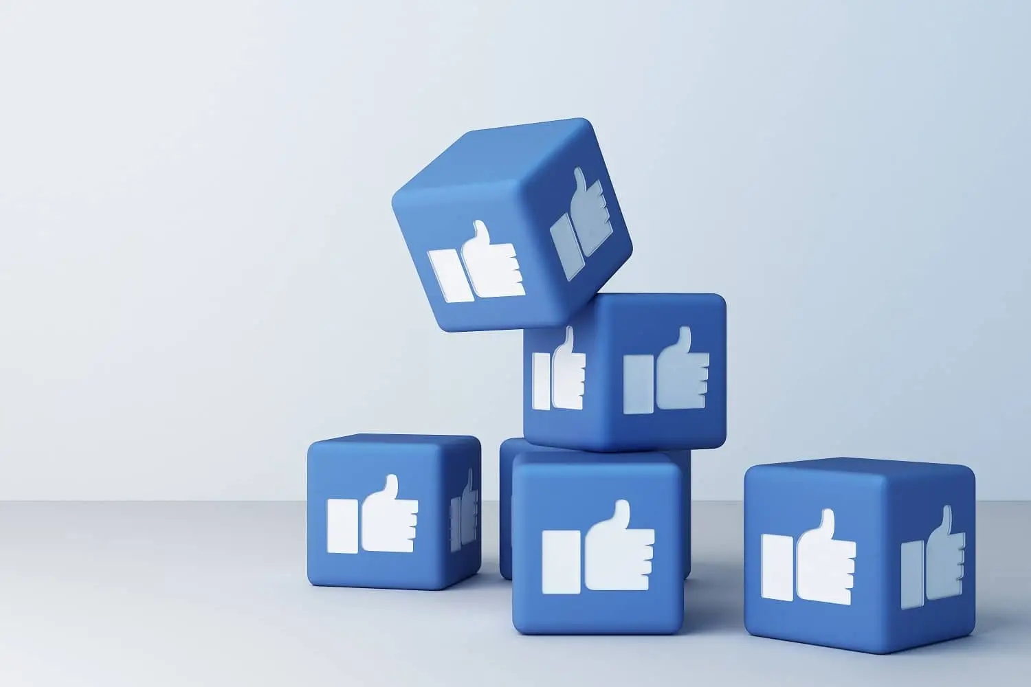 Photo of 3-D cubes with thumbs up symbols on them.
