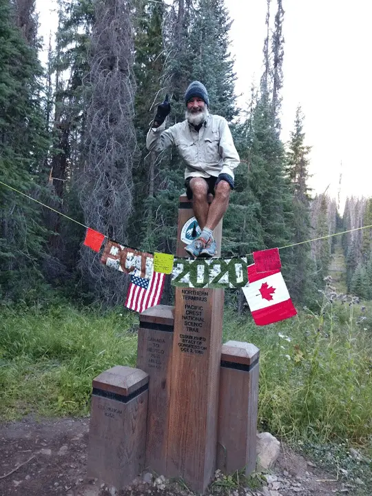 Perry Gabbard Monument Photo of Perry Gabbard celebrating the completion of hiking the Pacific Crest Trail.