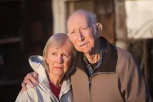Photo of a serious older man and woman.