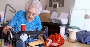 Photo of Eva, a 100-year-old seamstress.