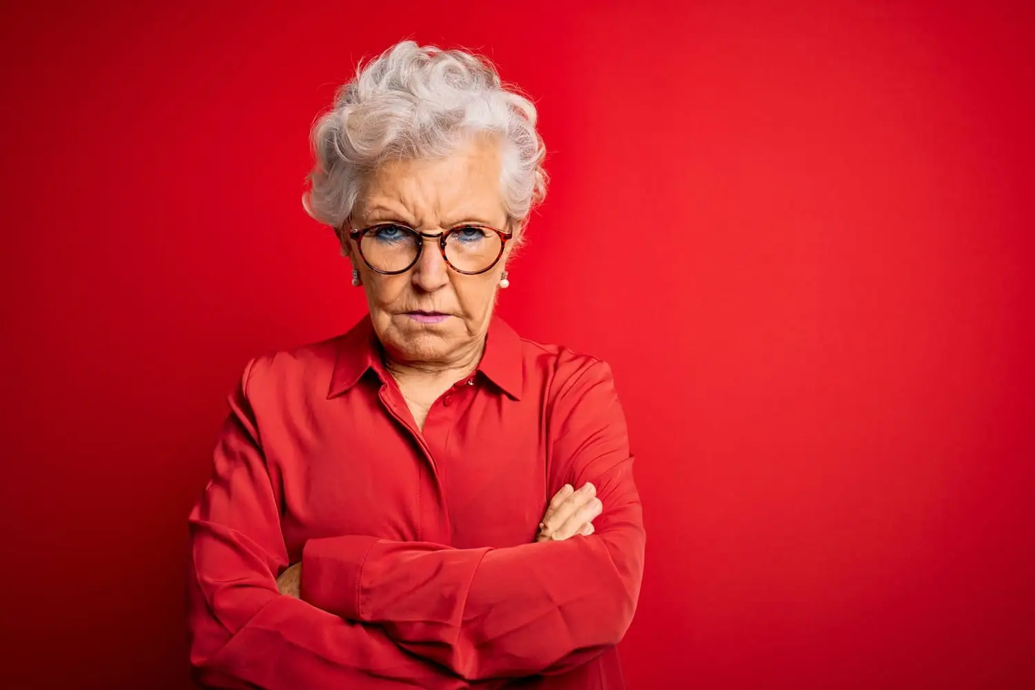 Photo of a grumpy older woman.