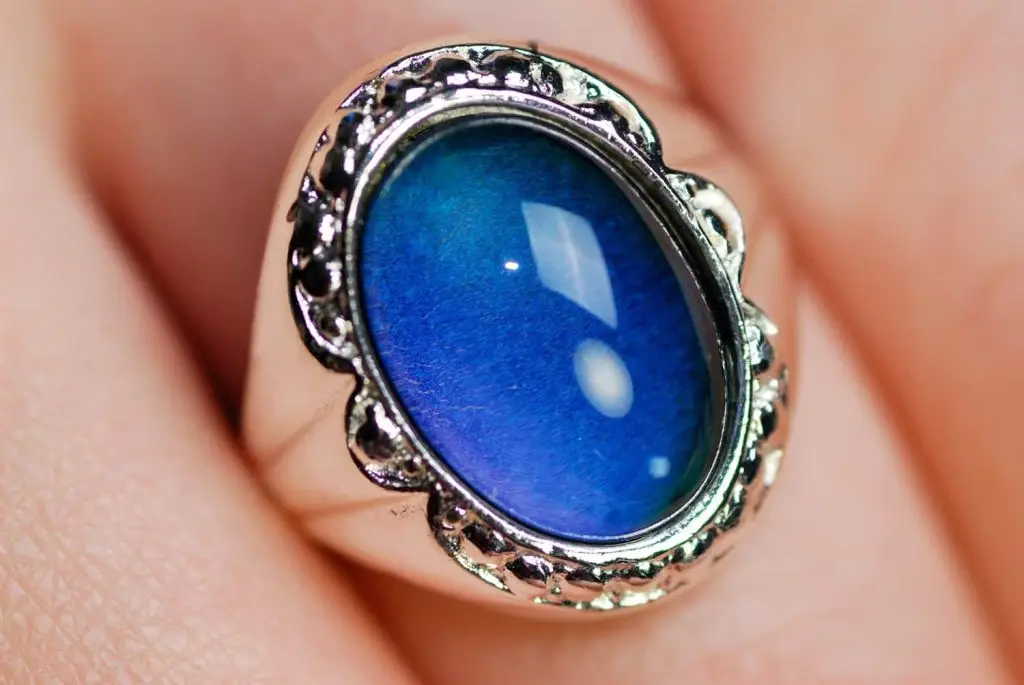 Photo of a woman wiring a mood ring.
