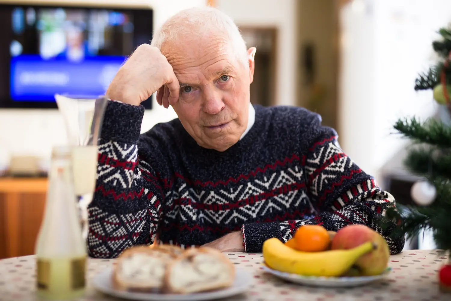 Photo of a sad, bored, isolated older man.
