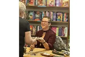 Julia Park Tracey signs books at a local bookstore.