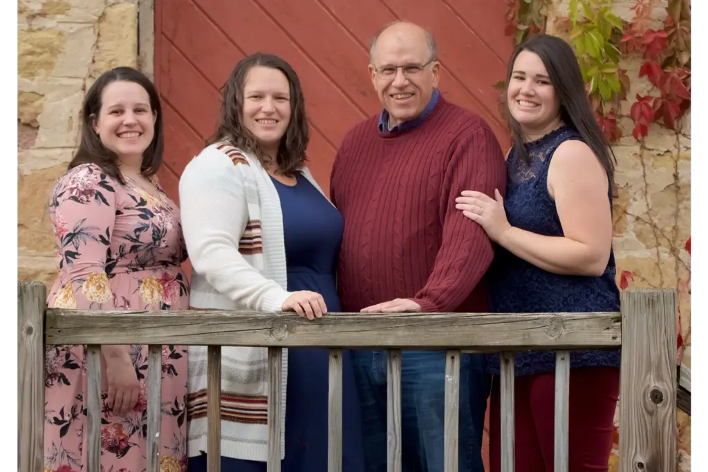 Photo of Greg Gerber with his daughters, from left: Kristin, Elizabeth and Rebecca, in fall of 2020